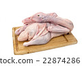 Raw duck on cutting board on white background 22874286