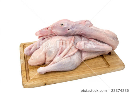 Raw duck on cutting board on white background 22874286