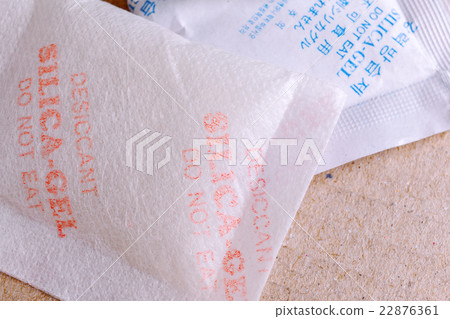 Close up silica gel or desiccant in paper bag Close up silica gel or desiccant in paper bag 22876361