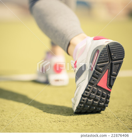 Sportswoman start running at the stadium Sportswoman start running at the stadium 22876406