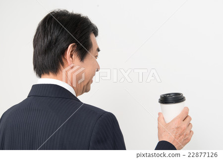 Businessman drinking coffee Businessman drinking coffee 22877126