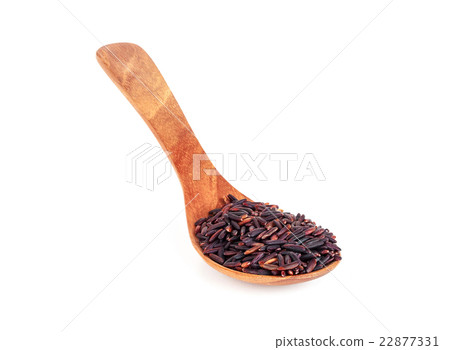 rice berry in wooden spoon isolated on white 22877331