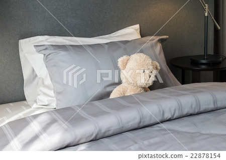 kids room with doll bear and pillows on bed 22878154