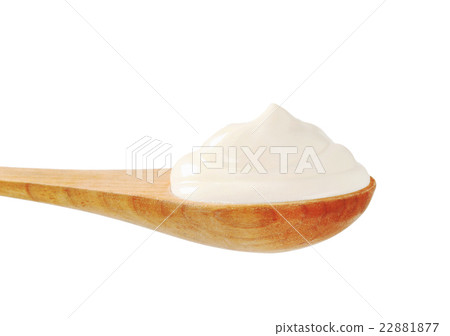 White cream on a wooden spoon White cream on a wooden spoon 22881877