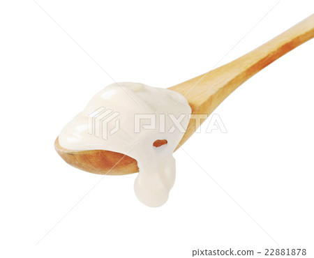 Sour cream on a wooden spoon 22881878