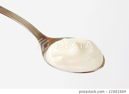 Plain yogurt on a spoon Plain yogurt on a spoon 22881884