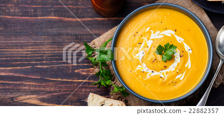 Pumpkin and carrot soup with cream and parsley Pumpkin and carrot soup with cream and parsley 22882357