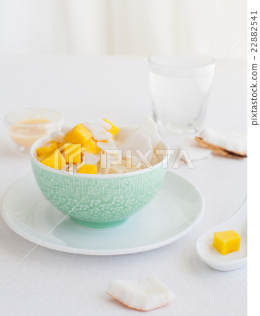 Rice pudding with mango and coconut water in bowl 22882541