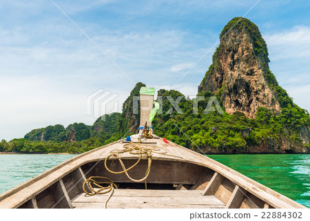 Front View of Long tail boat traveling to island 22884302