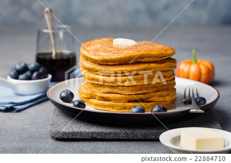 Pumpkin pancakes with maple syrup and blueberries 22884710