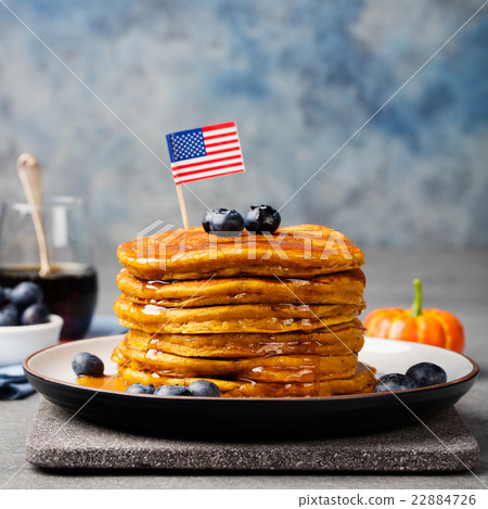 Pumpkin pancakes with syrup American flag on top 22884726
