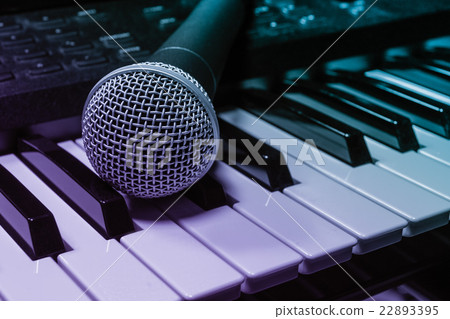 Music background microphone on piano background. Music background microphone on piano background. 22893395
