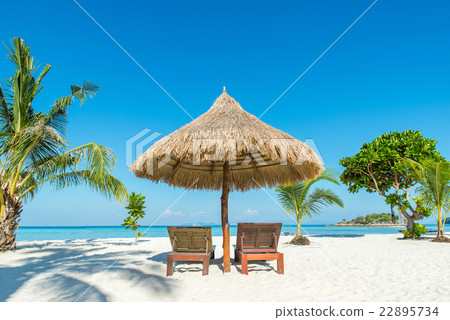 Beach Chairs and Umbrella in Phuket, Thailand. Beach Chairs and Umbrella in Phuket, Thailand. 22895734
