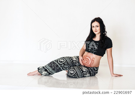 Pregnant girl with mehendi tattoo on her belly 22901697