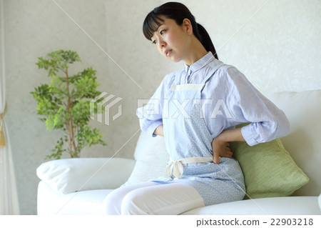 Housewife in need of low back pain Housewife in need of low back pain 22903218