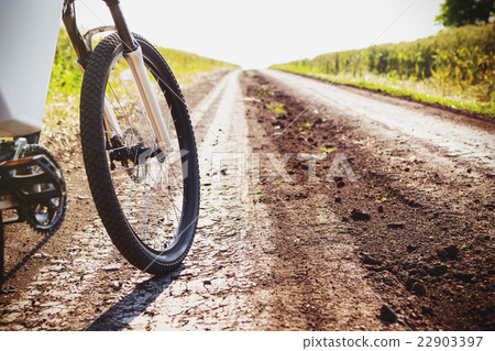 Mountain bicycle at sunny day on the dirt road 22903397