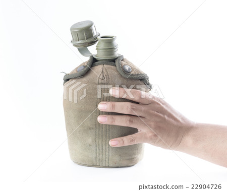 Man holding Military canteen isolated on a white  22904726
