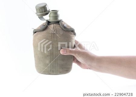 Man holding Military canteen isolated on a white Man holding Military canteen isolated on a white 22904728