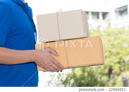 Delivery man holding a parcel box 22904851