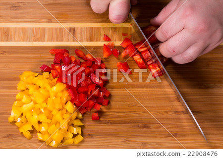 The chef cuts the peppers 22908476