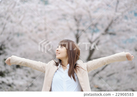 Business woman relaxing in front of cherry blossoms 22908583