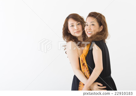 Two women in a fashionable dress 22910183