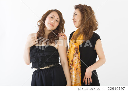 Two women in a fashionable dress Two women in a fashionable dress 22910197