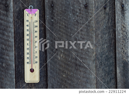 Wooden thermometer hang on old wood 22911224