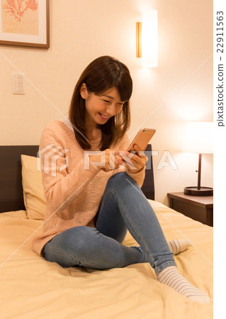 A woman relaxing in the room 22911563