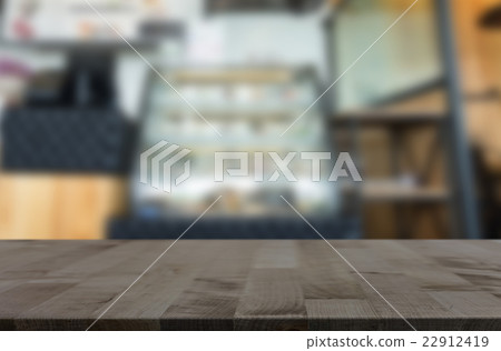 empty brown wooden table and Coffee shop blur bac 22912419