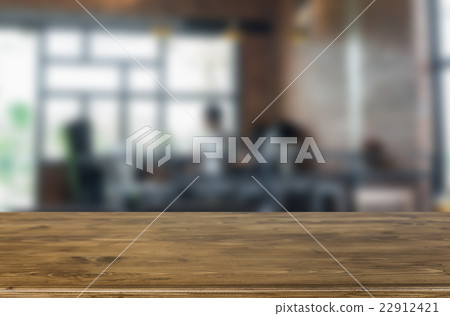 empty brown wooden table and Coffee shop blur bac 22912421