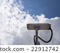Surveillance Security Camera on blue sky 22912742