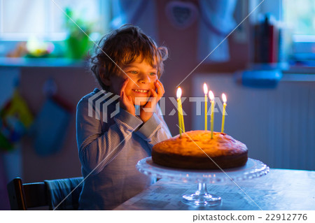 little kid boy celebrating his birthday with cake little kid boy celebrating his birthday with cake 22912776