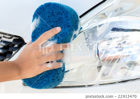 close up hand using sponge washing car close up hand using sponge washing car 22913470