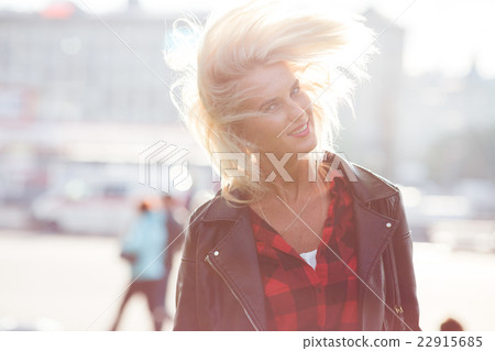 Beautiful young woman outdoor 22915685