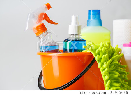 Bucket with cleaning items on light background Bucket with cleaning items on light background 22915686
