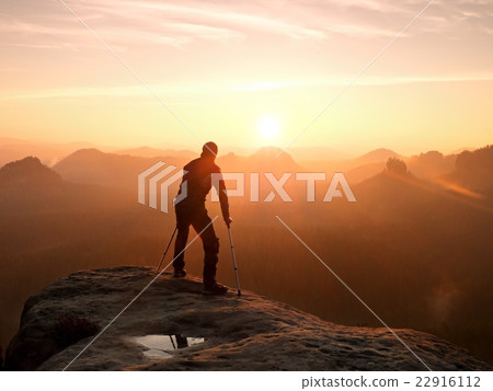 Bended man with broken leg and medicine crutch Bended man with broken leg and medicine crutch 22916112