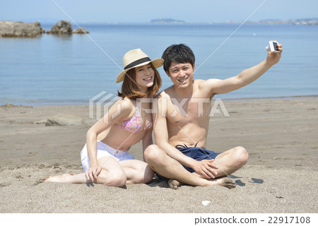A young couple cuddling up at the sea 22917108