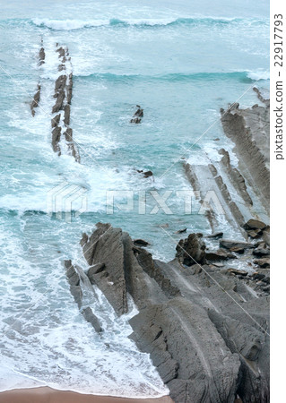 Evening ocean rocky coast. 22917793