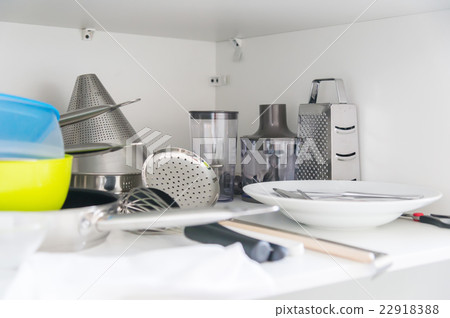 Various tableware on shelf in the kitchen Various tableware on shelf in the kitchen 22918388