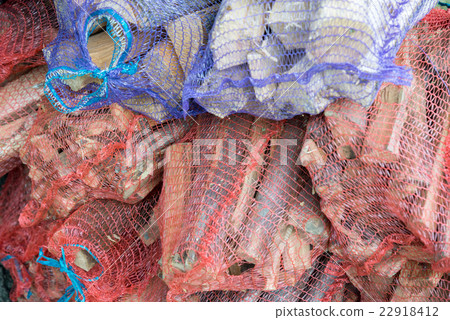 Firewood in net bag sold in the store Firewood in net bag sold in the store 22918412