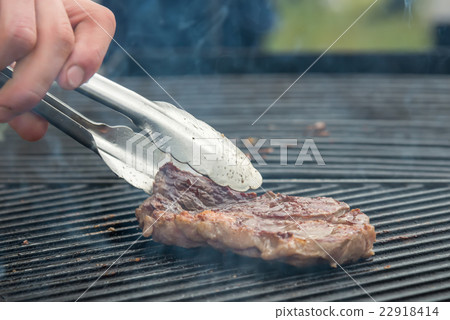 beef steaks on the grill 22918414