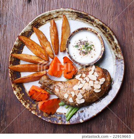 fried chicken drumsticks with french fries 22919663