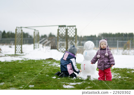 Little girls painting a snowman Little girls painting a snowman 22920302