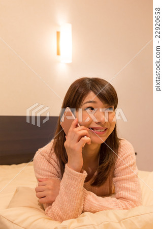A woman relaxing in the room A woman relaxing in the room 22920658