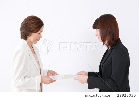 A woman giving a document 22925039