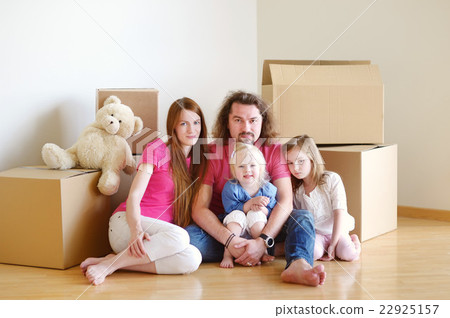 Happy young family in their new home Happy young family in their new home 22925157