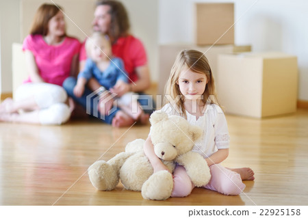 Happy little girl moving in her new home Happy little girl moving in her new home 22925158