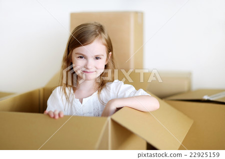 Happy little girl moving in her new home Happy little girl moving in her new home 22925159