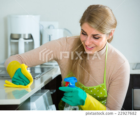 Housewife cleaning in home kitchen. 22927682